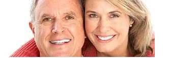 a couple smiling and holding each other