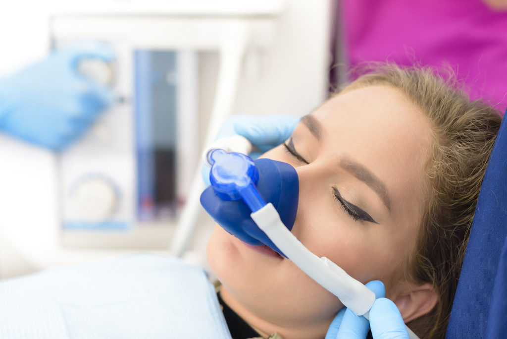 woman under sedation Durham Dental Solutions