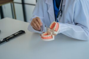 Dentist consulting with a patient about dental implants in a modern clinic