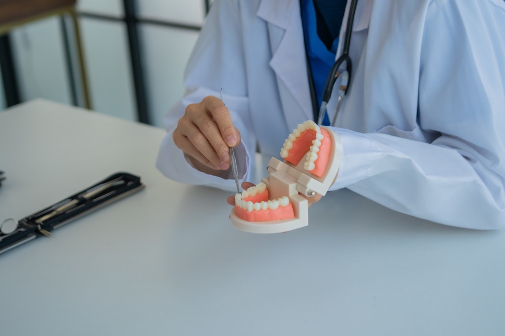 Dentist consulting with a patient about dental implants in a modern clinic